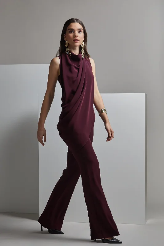 Sleeveless jumpsuit with pleats